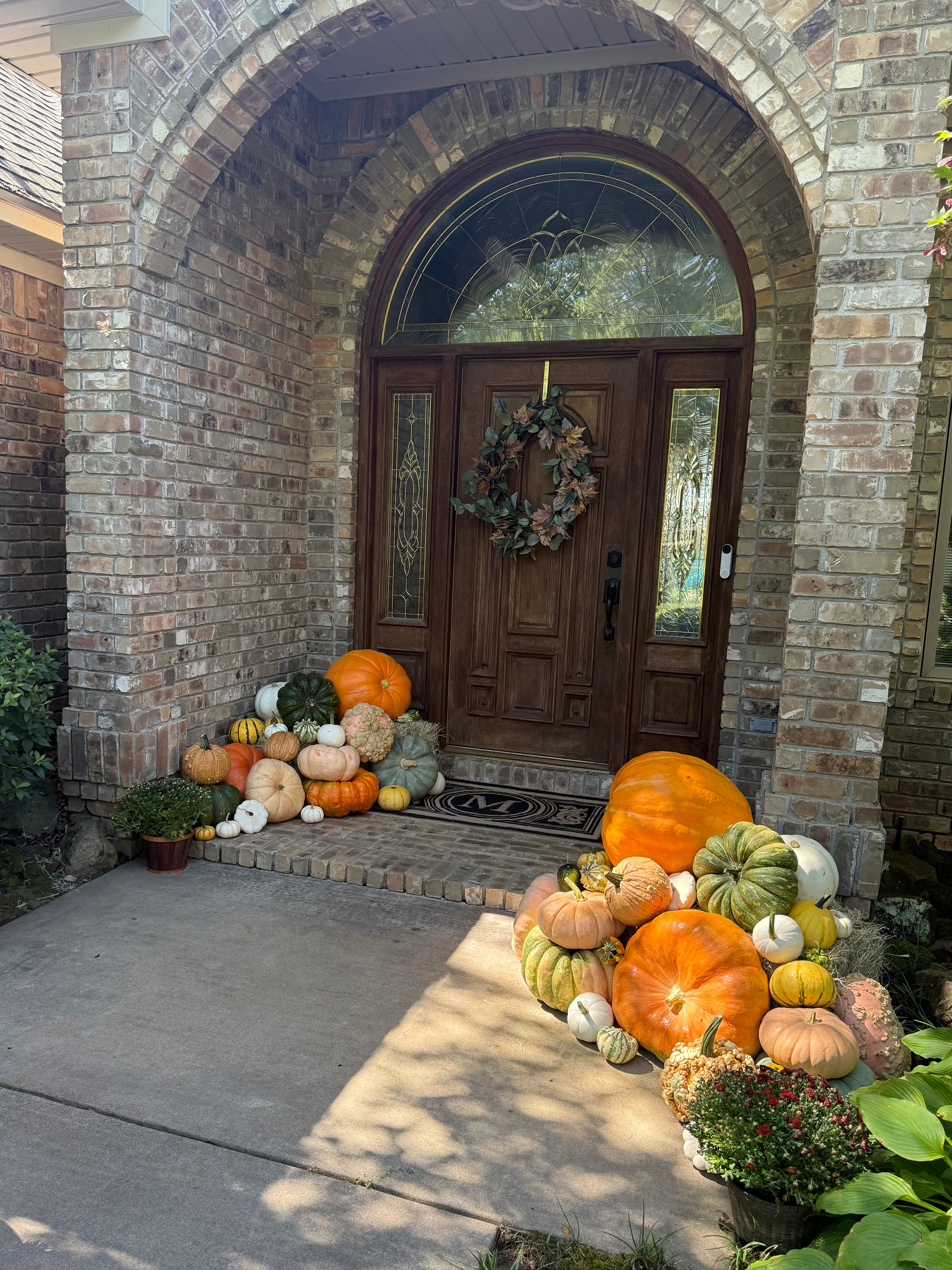 Elegant fall wreath and porch arrangement